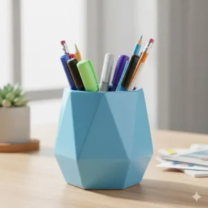 A ceramic, geometric sky blue pen holder filled with colorful pens and pencils, acting as a stylish desktop container.