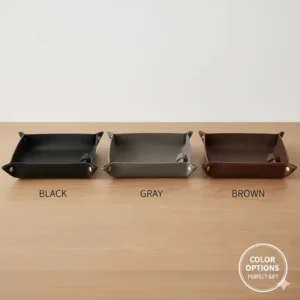 An arrangement of the different available colors (e.g., black, gray, brown) of the premium mens catch all tray, perfect for finding the right match.