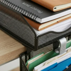 Heavy-duty steel hanging paper tray holding a large stack of printer paper and notebooks.