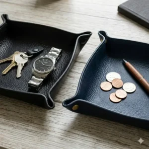 Comparison shot of black and navy blue leather catch all trays for home office organization.