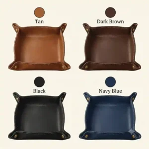 A color palette illustration showing a leather catchall tray in tan, dark brown, black, and navy blue.